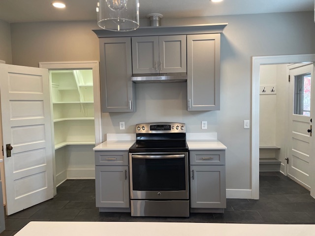 Cooking area showing walk-in pantry and shoe/coat foyer - 508 Daly Ave