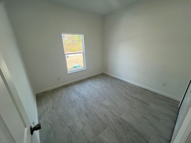 Building Photo - MODERN BRAND NEW RETREAT IN LEHIGH ACRES!