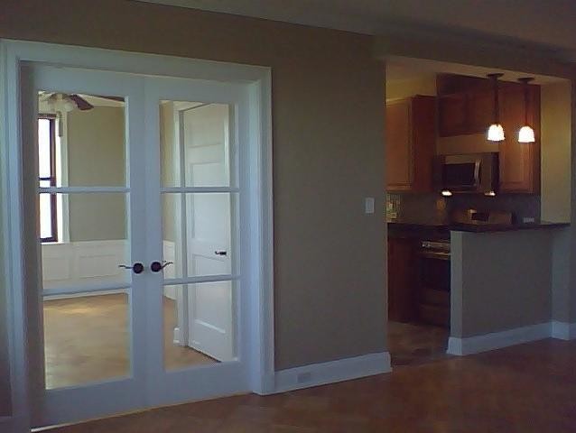 Living Room view into 2nd bedroom & kitchen - 2000 N Lincoln Park W