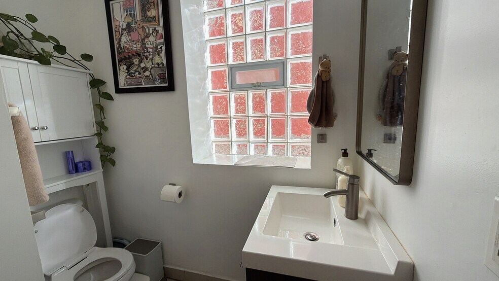 Stylish Bathroom Featuring a Floating Vanity - 1032 W 31st Pl