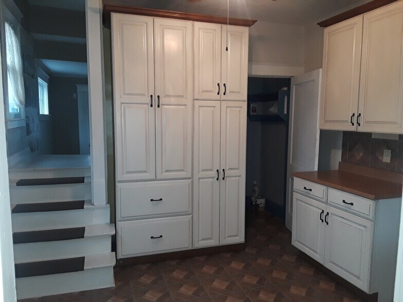 Eat in Kitchen with extra cabinetry and access downstairs - 4563 S 1st St