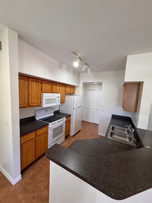 Building Photo - TWO BEDROOM CONDO IN GATED COMMUNITY