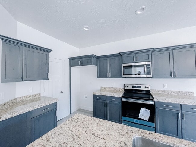 Building Photo - Brand New Idyllic Townhome in AF