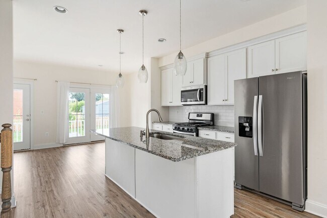 Building Photo - Your Next Home: Modern 3-Level Townhome with Garage, Deck & Huge Flex Space