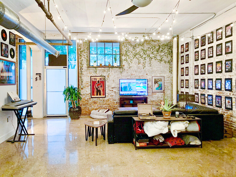 Living Area with 14' ceilings, polished concrete floors and exposed brick. - 659 Auburn Ave NE #145