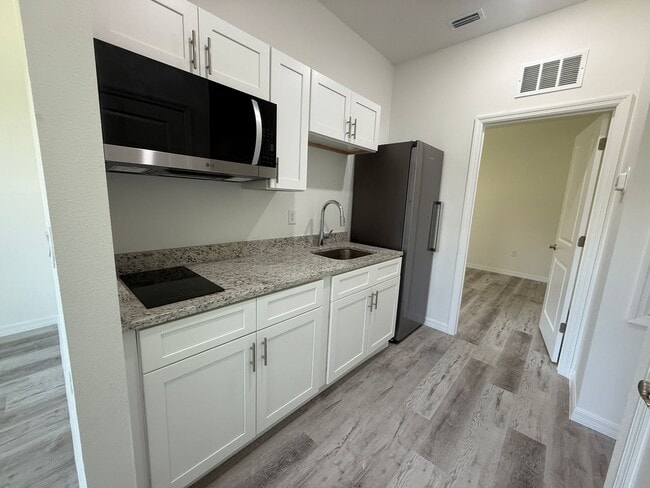 Building Photo - New Construction Suite! 1/1 Side entry uni...