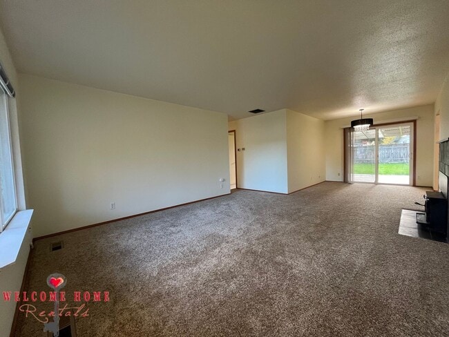 Building Photo - Beautiful Remodeled Rambler!!!  Come enjoy this HUGE backyard!!  NEW CARPET!!