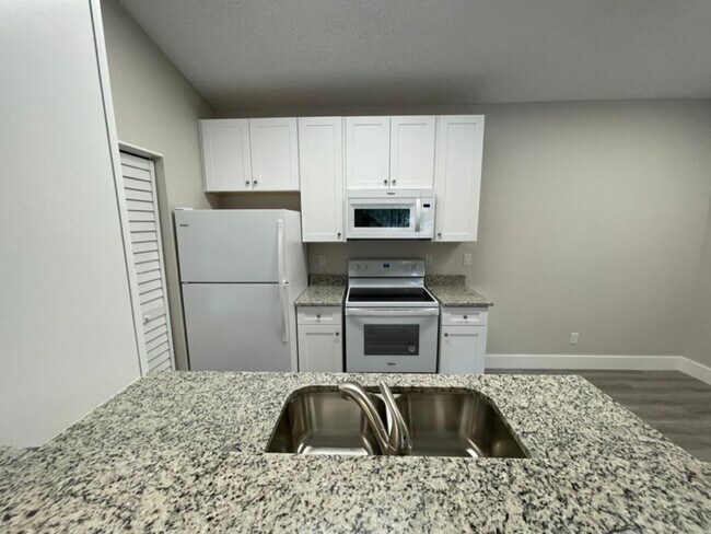 Building Photo - ANNUAL RENTAL - OASIS- 1 BED/1BATH