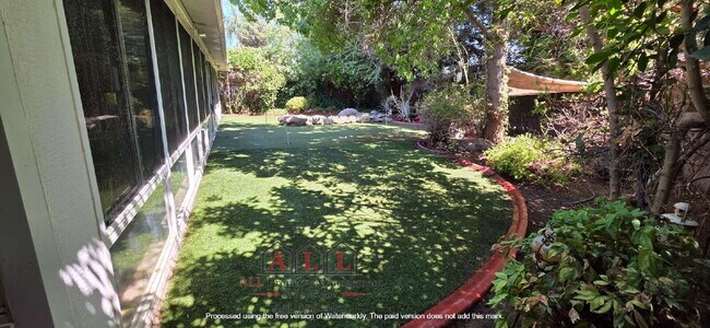 Building Photo - 3 Bed | 2 Bath Home with Office, Sunroom, Outdoor Kitchen & Backyard Oasis