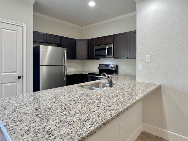 Building Photo - Spacious Townhome with a Private Backyard & No Rear Neighbors!
