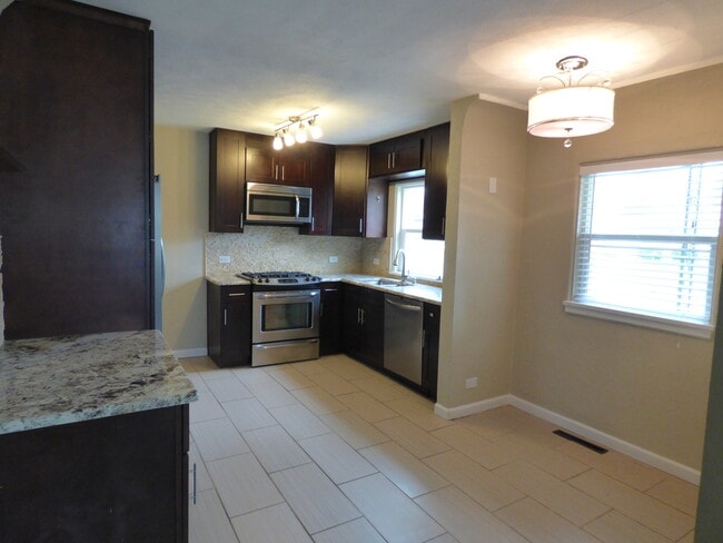 Building Photo - $0 DEPOSIT OPTION, CORY MERRILL, RECENTLY REMODELED, STAINLESS APPLIANCES, NEW CABINETS AND GRANI...