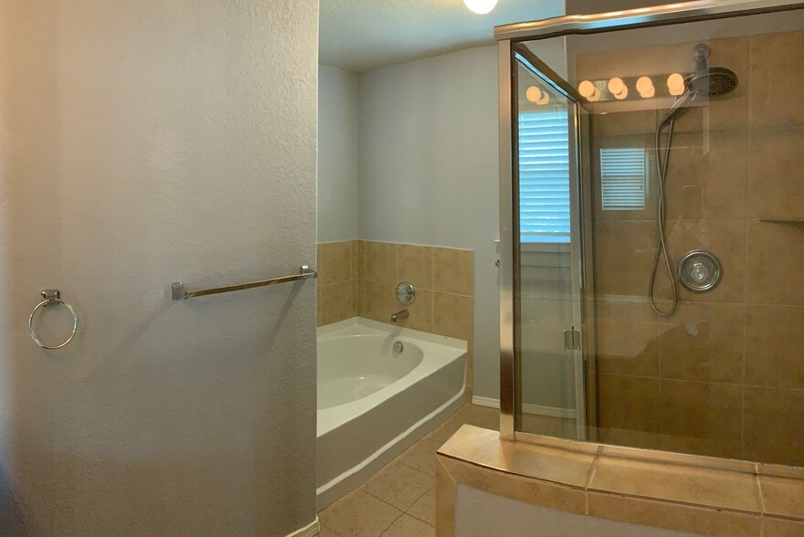 Master Bathroom: Separate tub and shower - 10219 Roseangel Ln