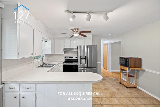 Building Photo - Spacious 4-Bedroom Home with Dual Kitchens...
