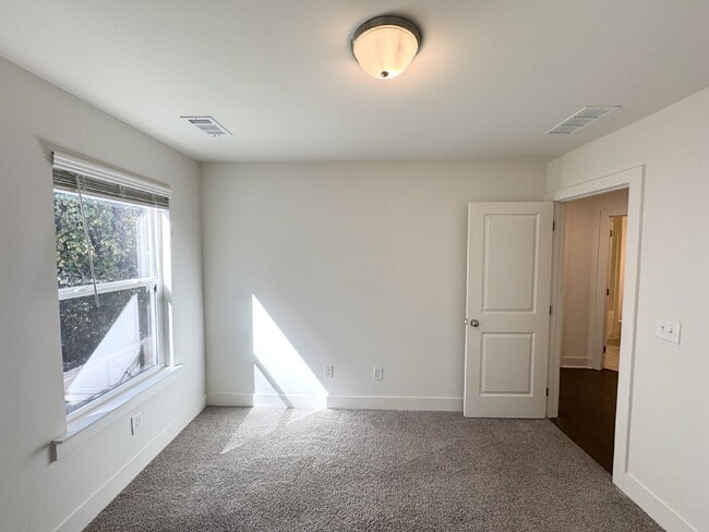 Building Photo - Stylish 3BR Townhome with Private Yard & T...