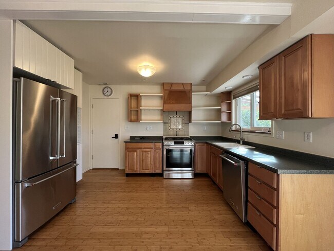 Building Photo - Light-Filled Home with Open Layout, Modern...