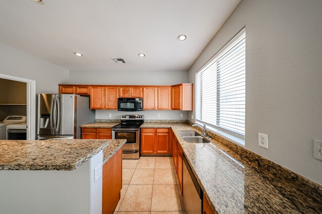 Building Photo - Welcome to this spacious 4 bedroom, 2.5 ba...
