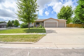 Building Photo - Spacious Ranch Home with 3-Car Garage, Finished Basement & Fenced Yard!