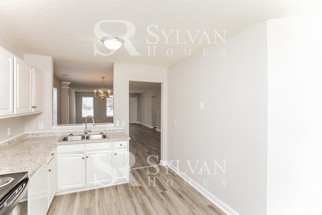 Building Photo - Welcome to this beautiful and sun-filled 3...