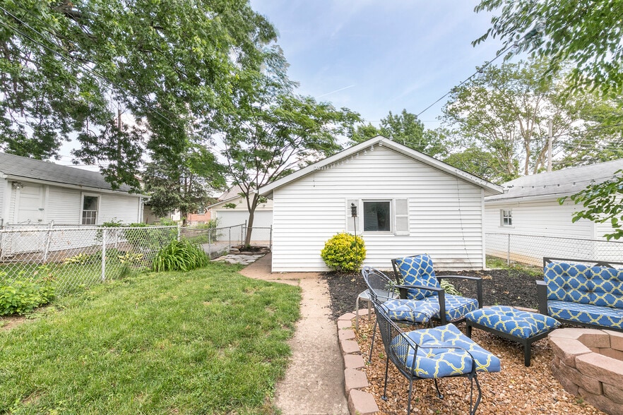 Fenced backyard with fire pit and detached garage - 4945 Delor Street