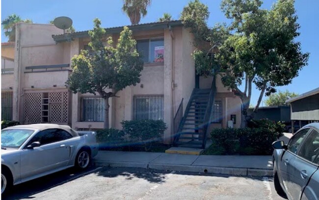 Building Photo - 2 BR 2 BA Corner Condo w/Balcony W/D Gated Entry Carport + Space