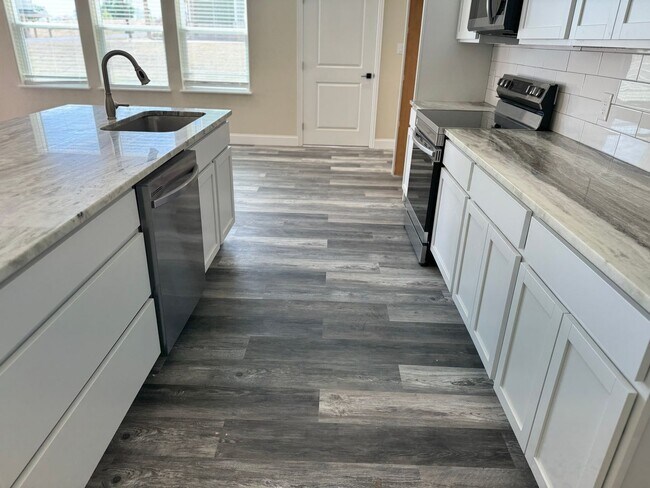 Building Photo - COMING SOON.....Modern Townhome with private fenced yard! HIGH CEILINGS PETS WELCOME