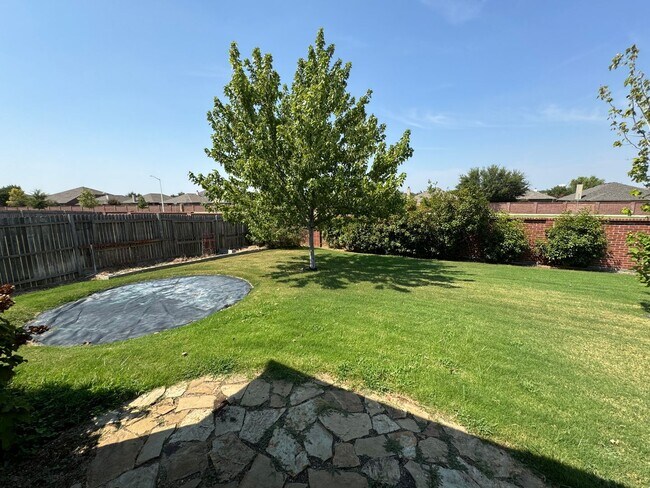 Building Photo - Argyle ISD Gem with Huge Private Backyard & Open Floorplan