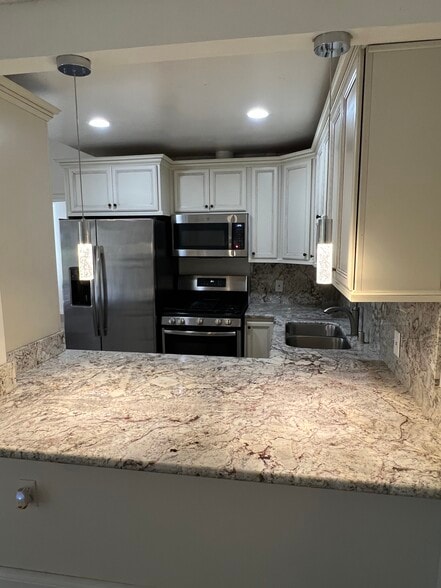 Stainless Refrigerator & Stove - 19156 Avenue of the Oaks