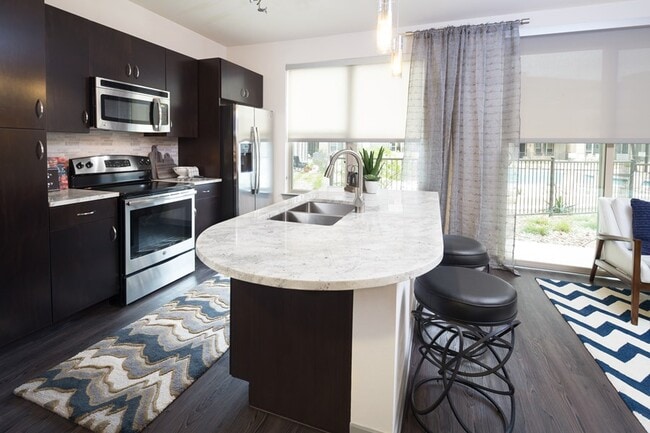 Building Photo - Spacious Than You Think & Richly Featured