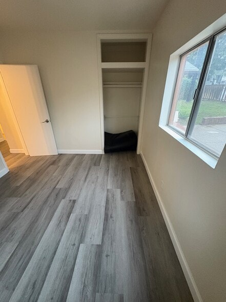 Bedroom #2 looking back toward the entry door and hallway, closet is on the right - 23162 Smith Rd
