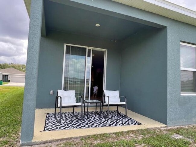 Building Photo - Open concept home offering four bedrooms, three baths, a two car garage and open lanai.