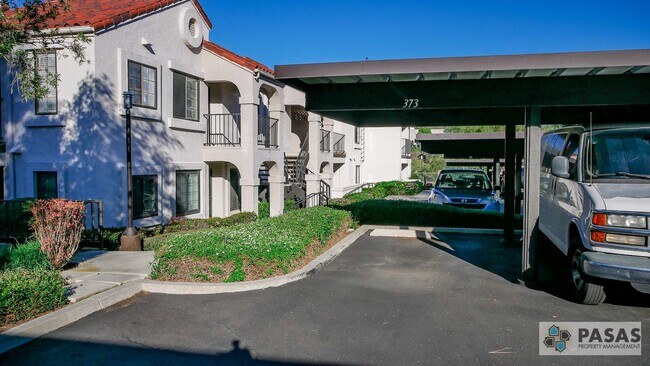 Building Photo - Bright Upgraded Condo w/ Quartz Kitchen, Covered Parking, Pool & Spa