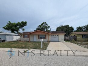 Building Photo - 3 bed,2 bath ~ With garage, workshop & shed!! NEW floors, NEW paint! Updated bathroom & kitchen w...
