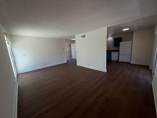 Building Photo - Recently updated home with new floors, paint & bathroom!
