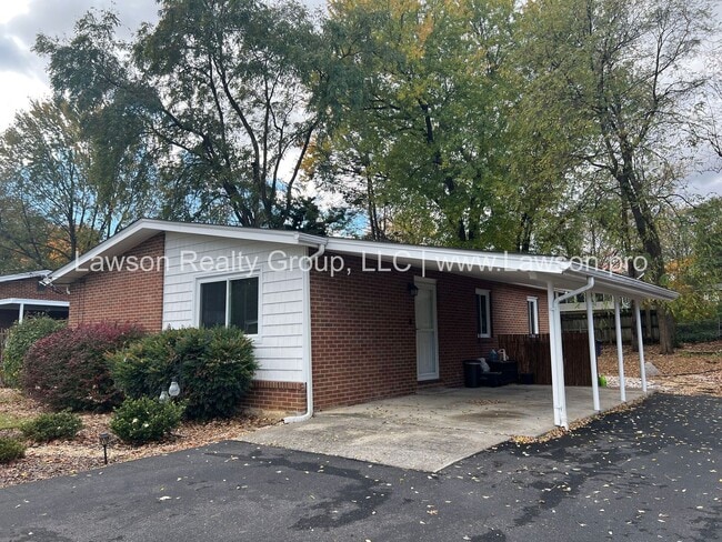 Building Photo - Charming Brick Ranch with Beautifully Landscaped Yard and Attached Carport