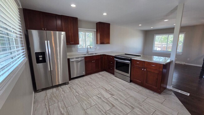 Building Photo - 4 Bedroom 2 Bath with Finished Basement and Study!