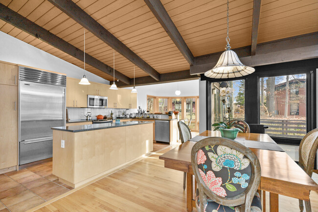 Open layout of the dining area, kitchen, and breakfast room. - 19 Cottontail Ln