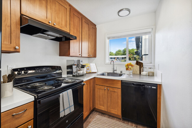 Elevate your culinary experience in this stylish and functional kitchen. - Alturas Vose Townhomes