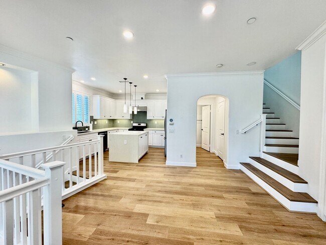Building Photo - Beautifully Remodel Townhouse with AC & Two Car Garage!