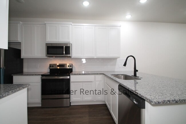 Building Photo - Upscale Four-Bedroom Townhome!