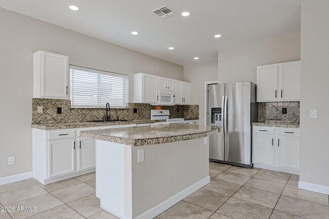 Building Photo - 15569 W Gelding Dr