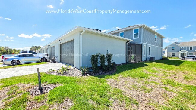 Building Photo - EXCEPTIONAL AND SPACIOUS FURNISHED TOWNHOME WITHIN WATERSIDE- NAUTIQUE!