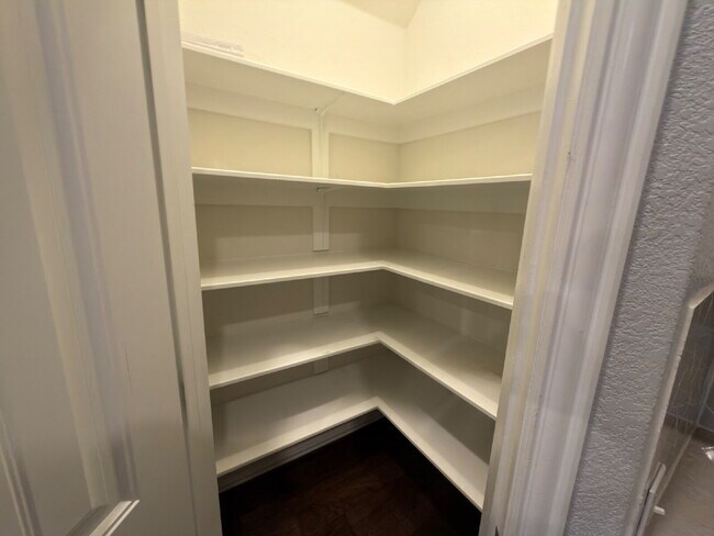 Building Photo - Four bed two bath on a corner lot with a pool in Sunfield. Gas cook top, double ovens. Open kitch...