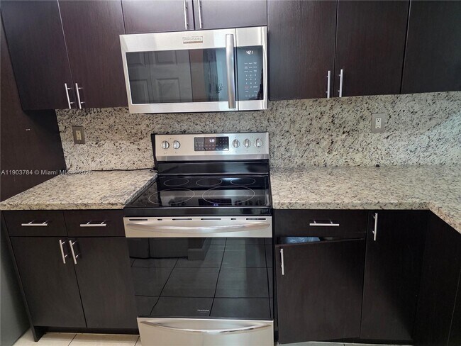 Building Photo - 9917 W Okeechobee Rd