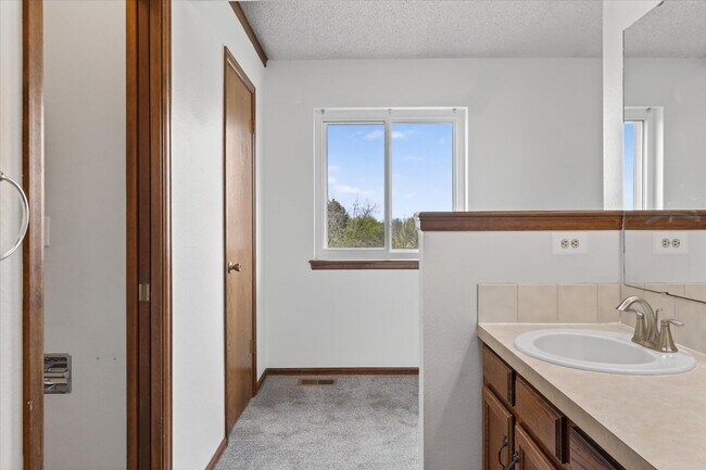 Building Photo - 4BR/4BA Updated Home with Finished Basement Suite & Landscaped Yard