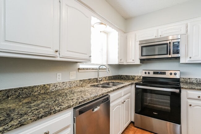 Building Photo - 4 BR/2BA | Updated Single Family Home | Gorgeous hardwoods | Storage attic!