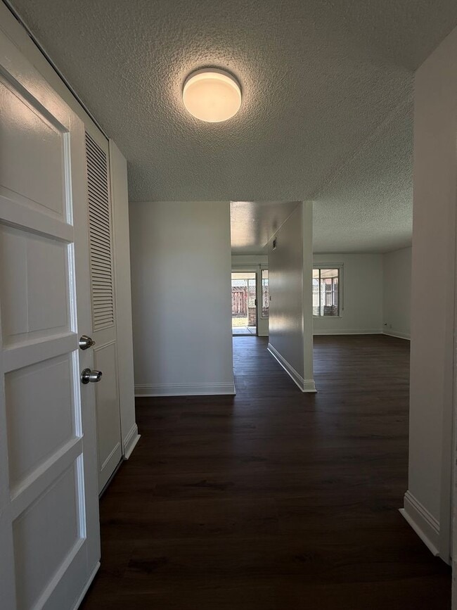 Building Photo - Recently updated home with new floors, paint & bathroom!