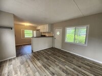 Building Photo - FRESHLY PAINTED AND NEW FLOORING! 2 Bed 1 Bath With Screened Porch