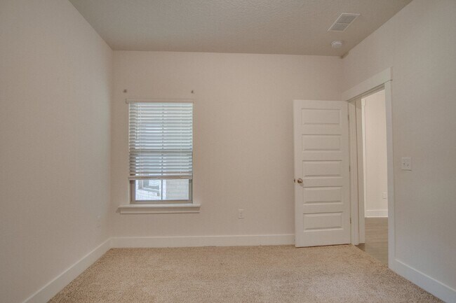 Building Photo - Spacious Cantonment Townhome with Open Layout, 2-Car Garage, Covered Back Porch & Easy Access to ...