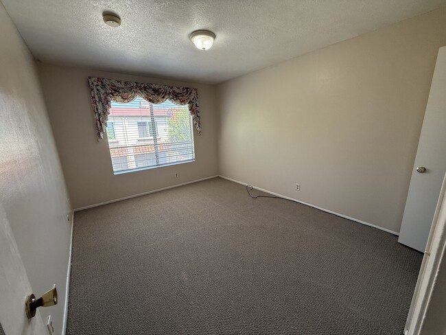 Sunny secondary bedroom with ample closet space - 1134 W Huntington Dr