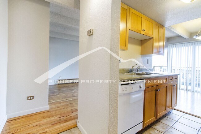 Building Photo - Cozy Condo with Assigned Parking Spot and Balcony